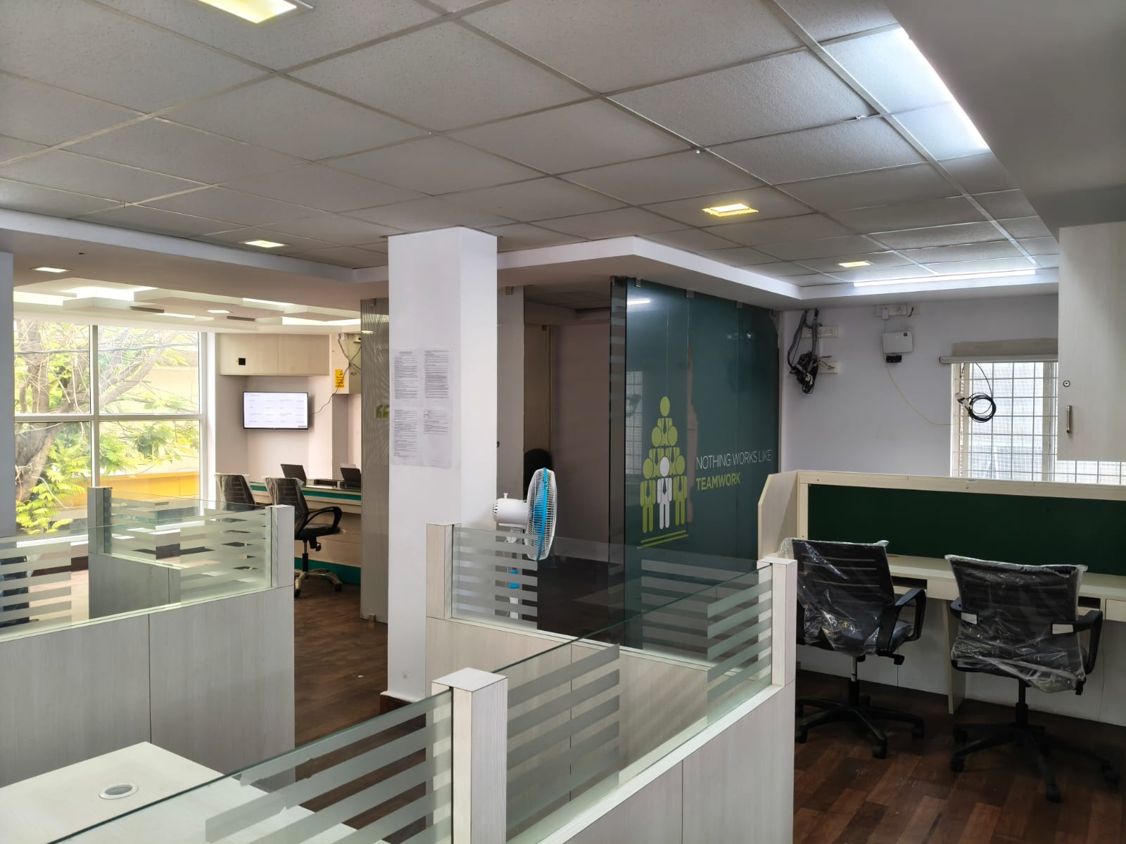 Open workstation floor with glass partitions